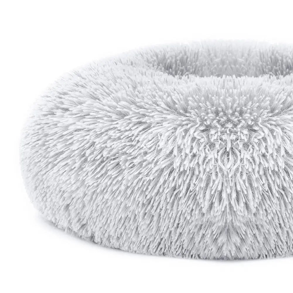 Plush fleece donut pet bed for cats and small dogs featuring soft fluffy gray fur-like circular design