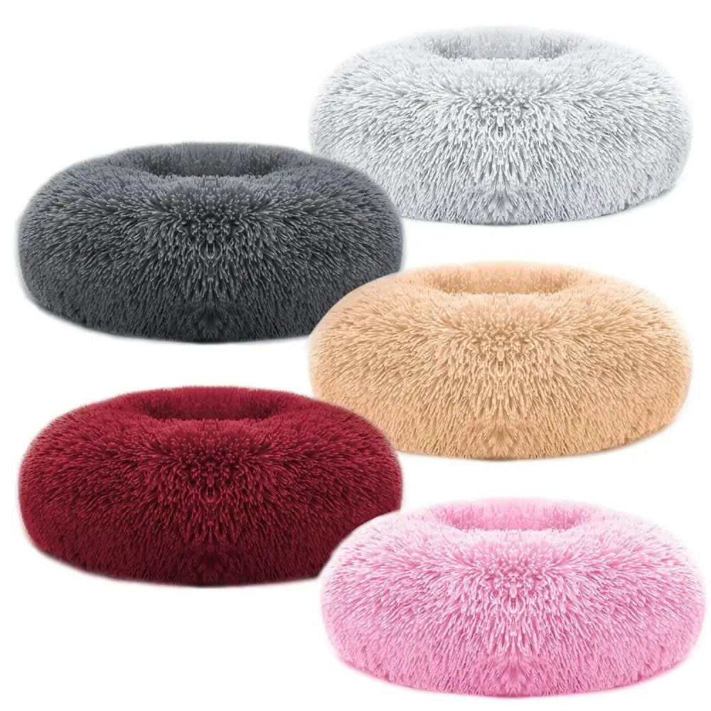 Plush fleece donut pet bed in soft gray beige red and pink hues with a plush faux fur exterior for cats and small dogs