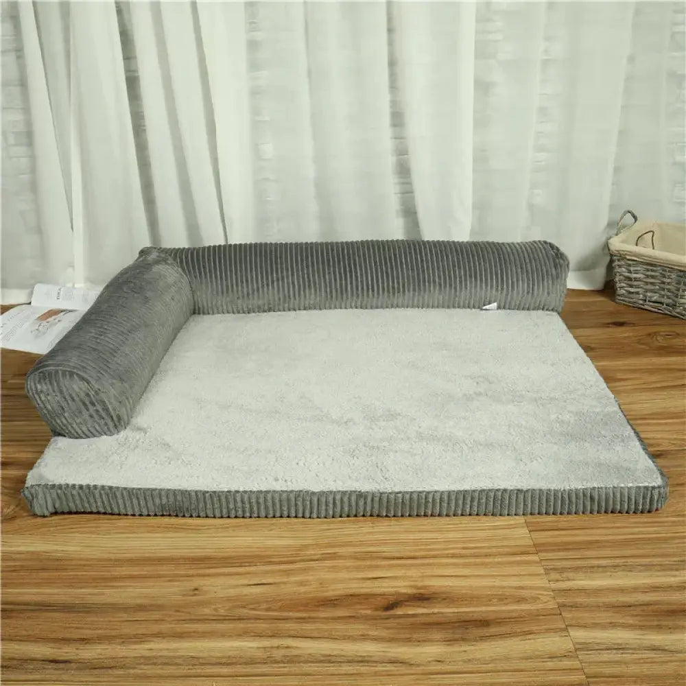 Premium corduroy plush orthopedic pet bed in gray with a white cushioned surface and rolled-up sides for comfort