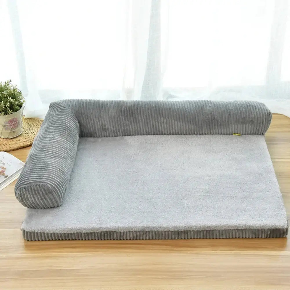 Premium gray corduroy plush orthopedic pet bed with soft interior and rolled-up sides for enhanced comfort