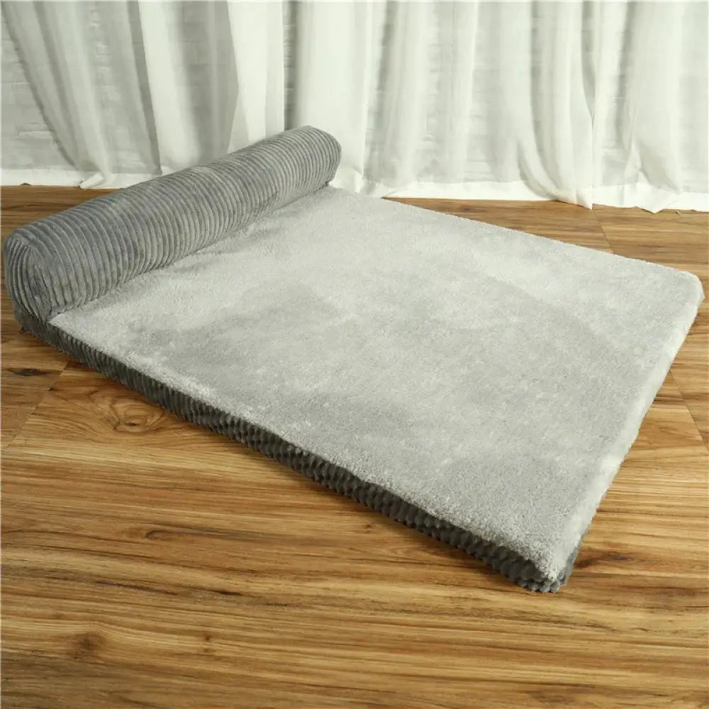 Premium gray corduroy plush orthopedic pet bed with soft textured surface and ribbed edges for comfort