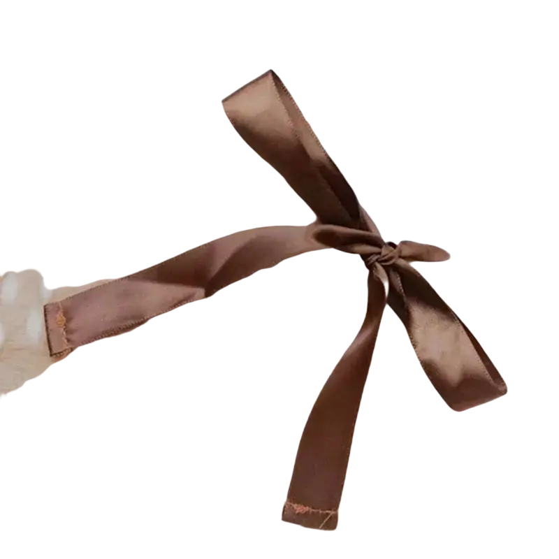 A glossy brown satin ribbon tied into a neat bow on pet dog clothes reindeer winter costume accessory