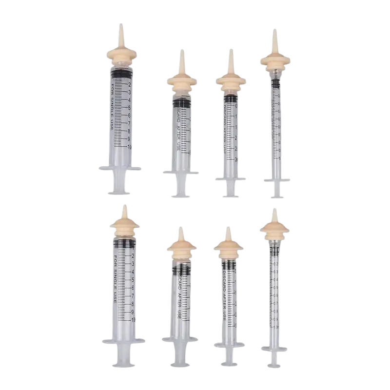 Set of six clear plastic pet feeding syringes with beige caps and black markings 3ml 5ml 10ml item type for single use