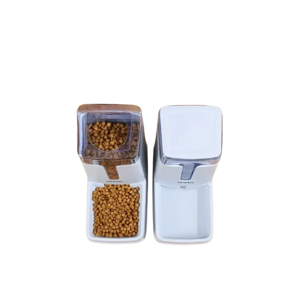 White plastic pet food dispenser with transparent top compartment filled with brown kibble and matching white base
