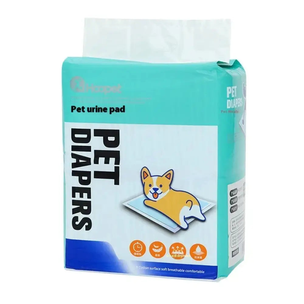 Teal and white package of super absorbent leak proof puppy training pads with cartoon corgi illustration