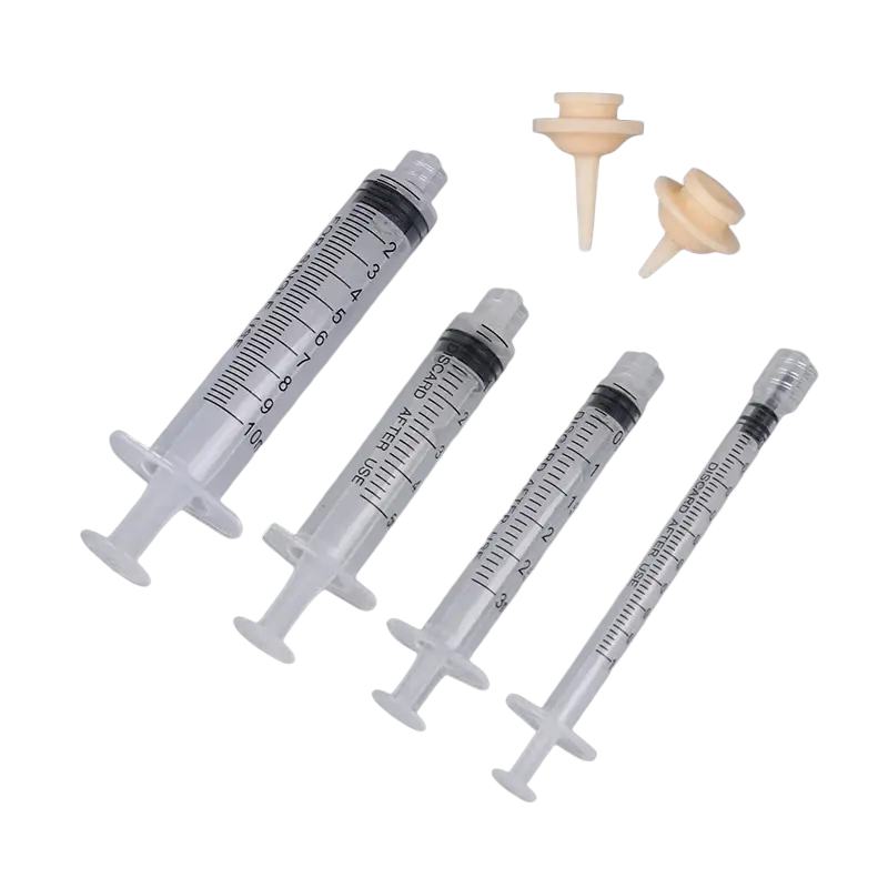 Set of clear plastic oral syringes in 1ml 3ml 5ml sizes with black plungers and beige silicone nipple caps for pets