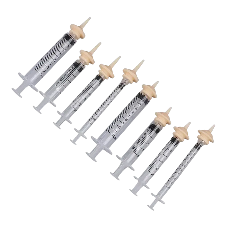 Set of six clear plastic oral syringes with beige caps and black markings in 1ml 3ml 5ml sizes for pet use