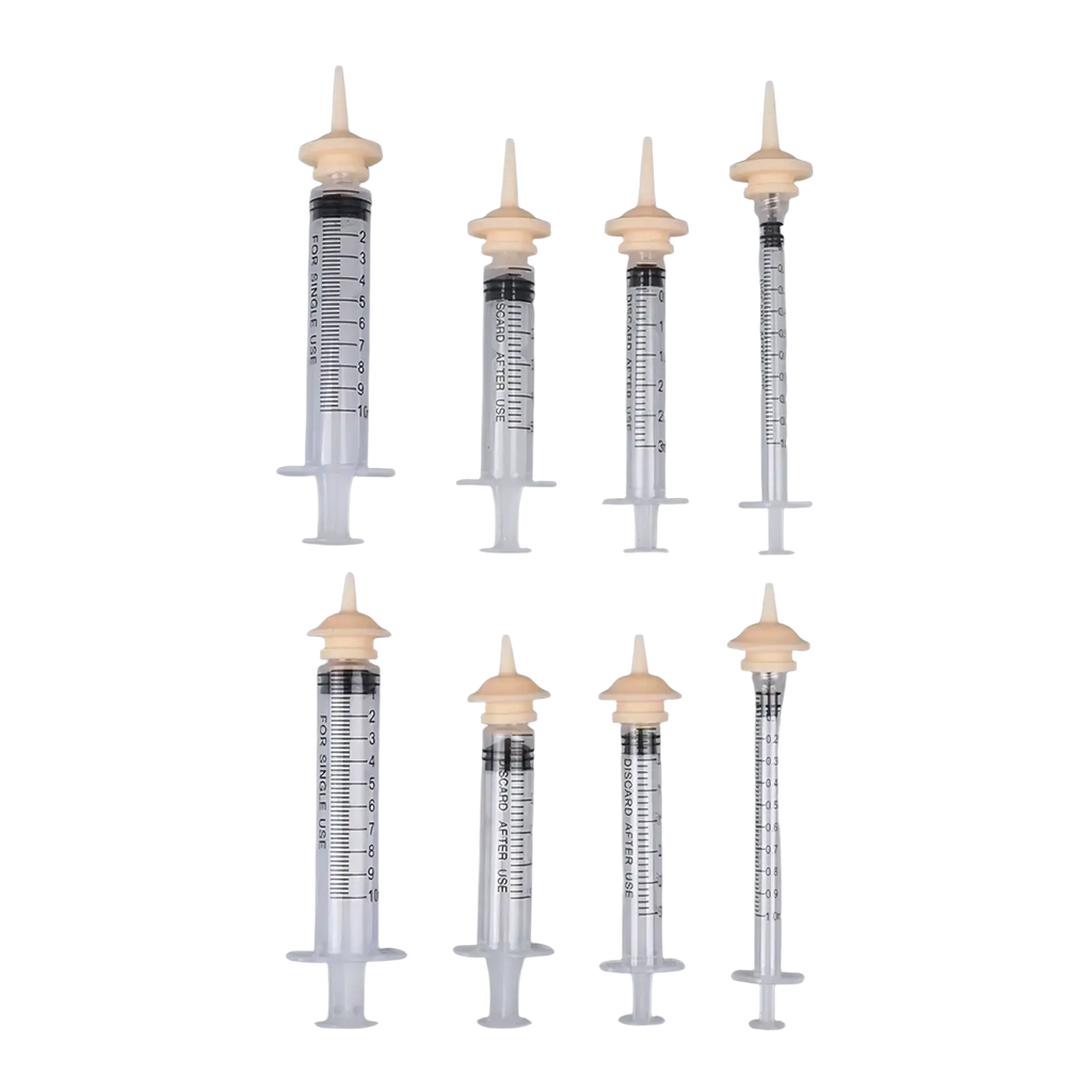 Set of six clear plastic pet oral syringes with beige caps and black markings designed for single use with silicone nipples