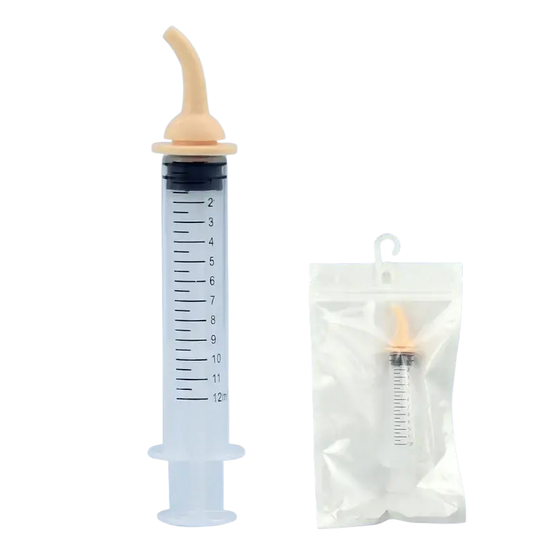 Clear plastic pet oral syringe with beige curved silicone nipple feeder and black plunger top for medication delivery