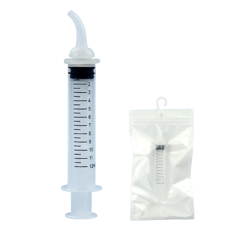Clear plastic nasal irrigation oral syringe with curved white tip and black plunger next to its packaging for pets