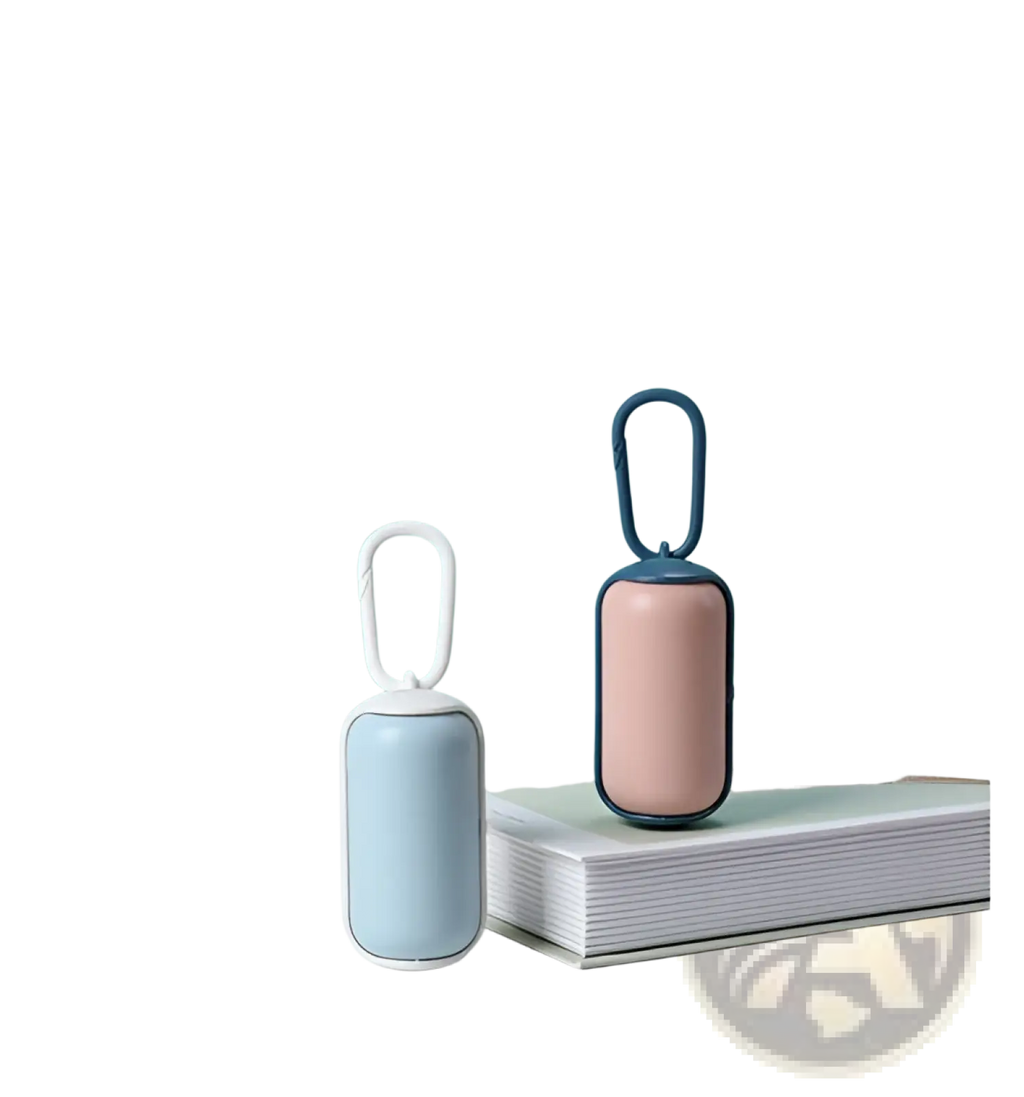 Two compact cylindrical pet poop bag dispensers in pastel blue and blush pink with metal carabiner clips for carrying