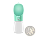 A sleek mint green silicone pet water bottle with a clear plastic base and paw-print button for travel use