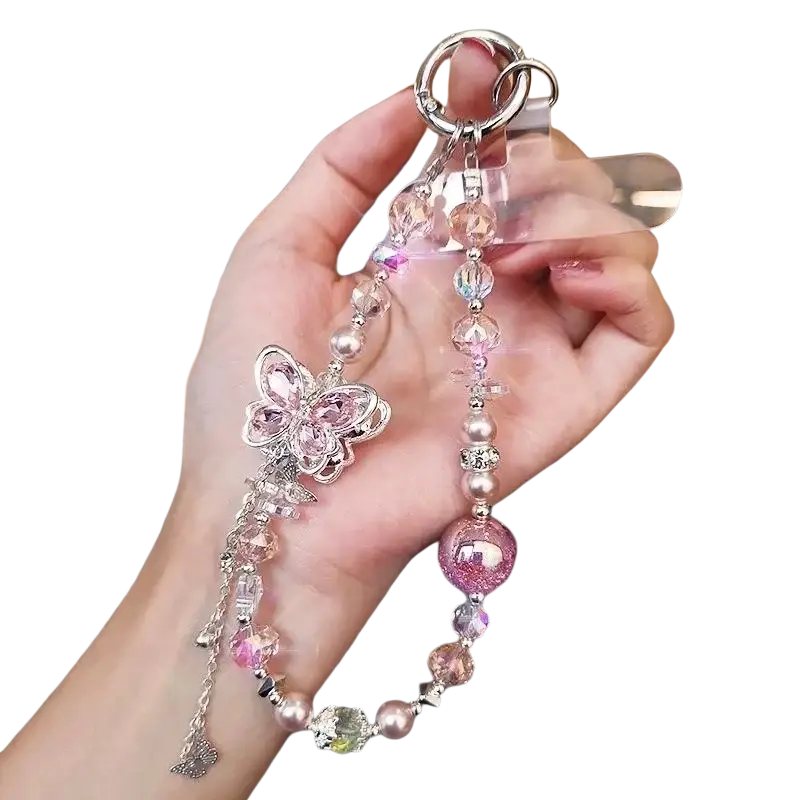 A delicate pink and silver butterfly mobile phone chain adorned with sparkling beads crystals and a glittery sphere