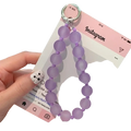 A delicate lavender jelly beaded phone wrist strap with a silver metal ring for secure carrying