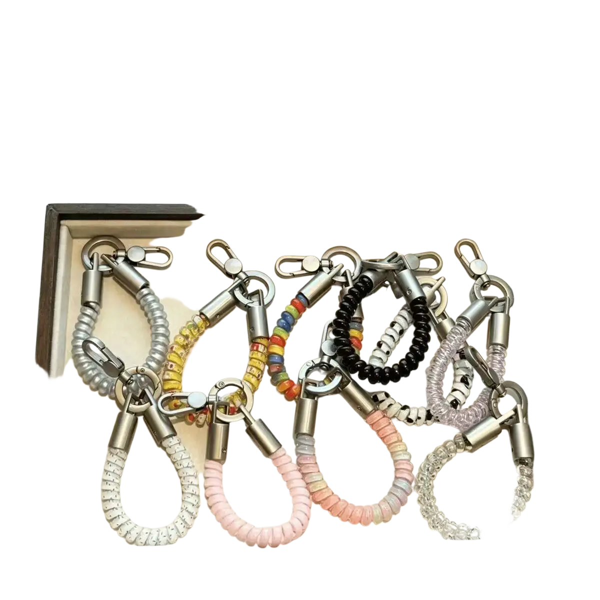 Phone wrist strap keychain coil lanyard with colorful coiled bands metallic clasps and assorted pastel bead patterns