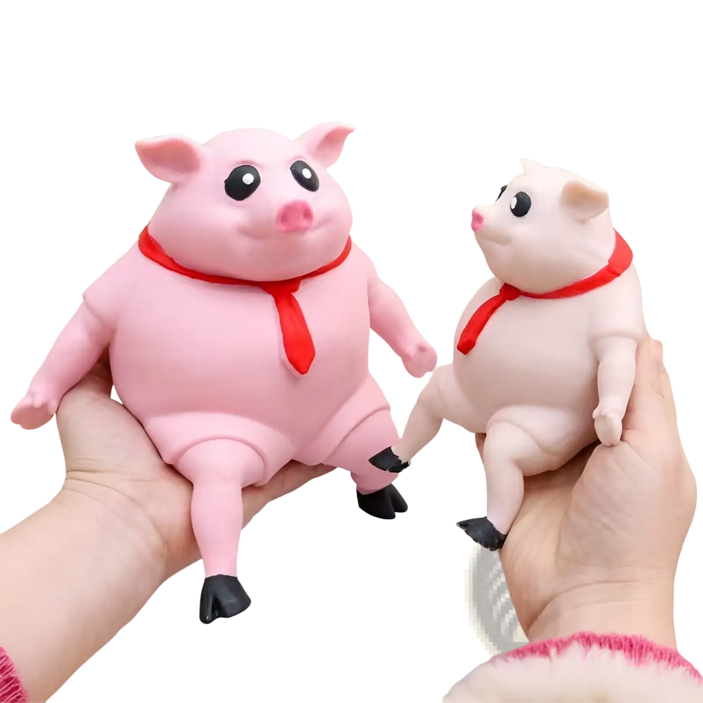 Pink and white plastic piggy squeeze toy with red scarves for stress relief and cute pink pig gift