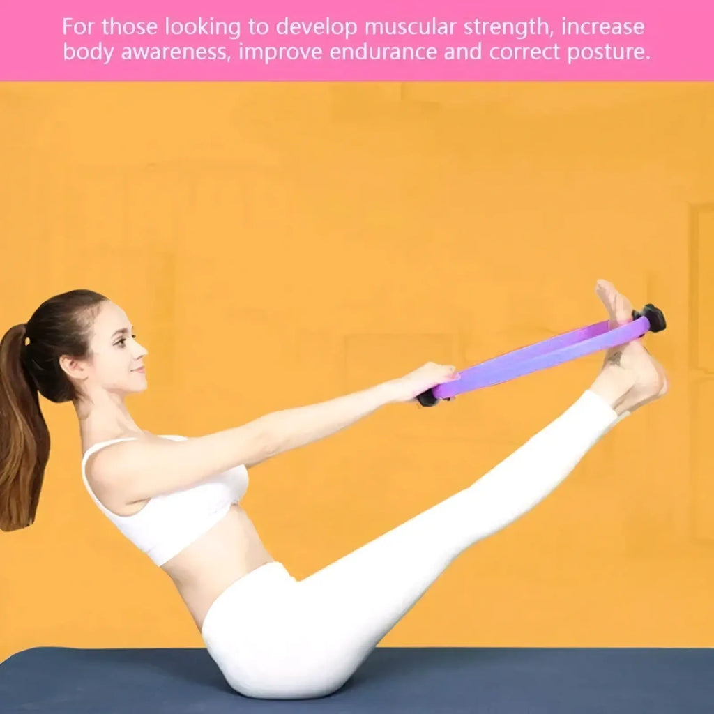 Purple Pilates ring dual grip exercise circle with black handles designed for resistance training and toning
