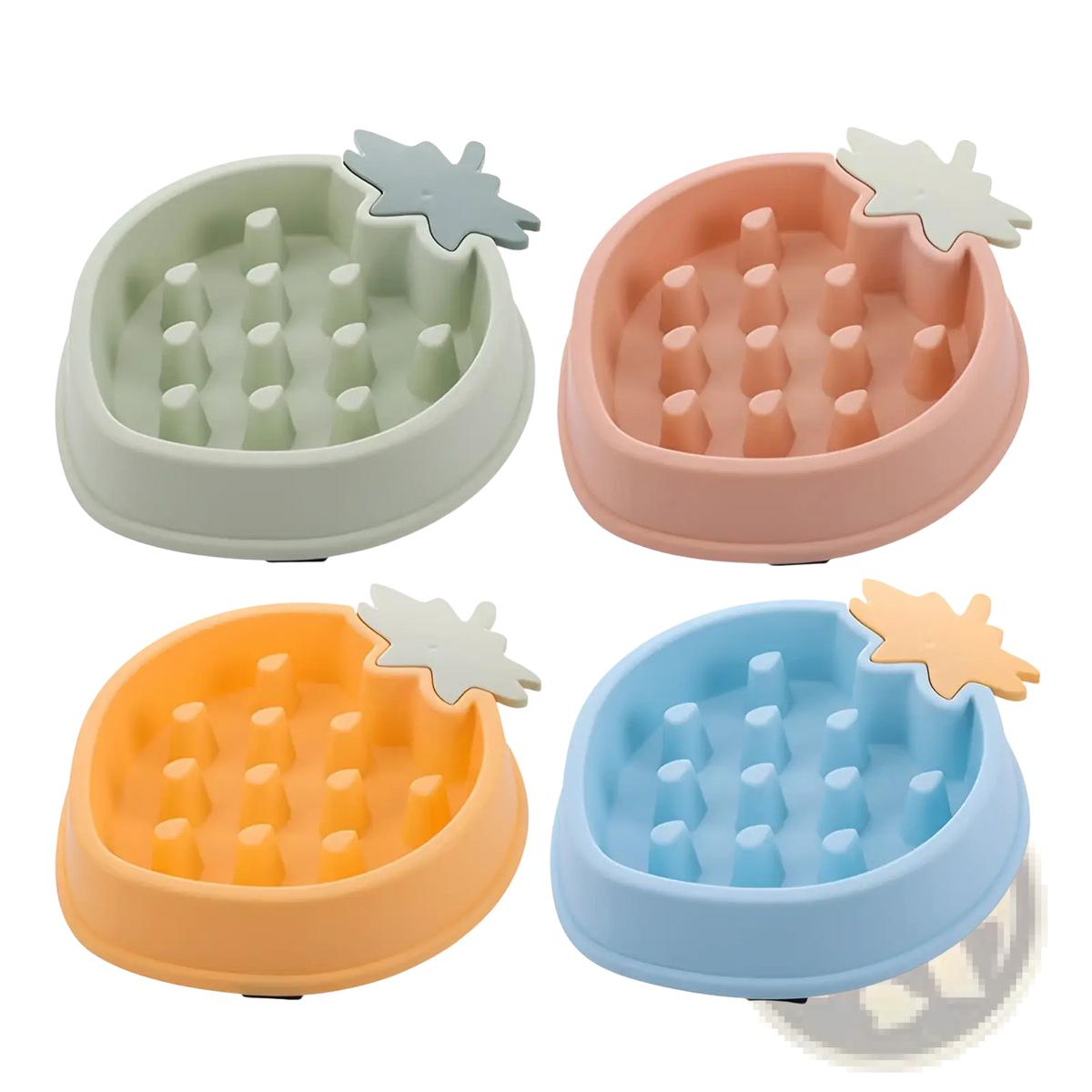 Four colorful silicone pineapple slow feeder dog bowls with leaf accents and textured ridges for slow eating