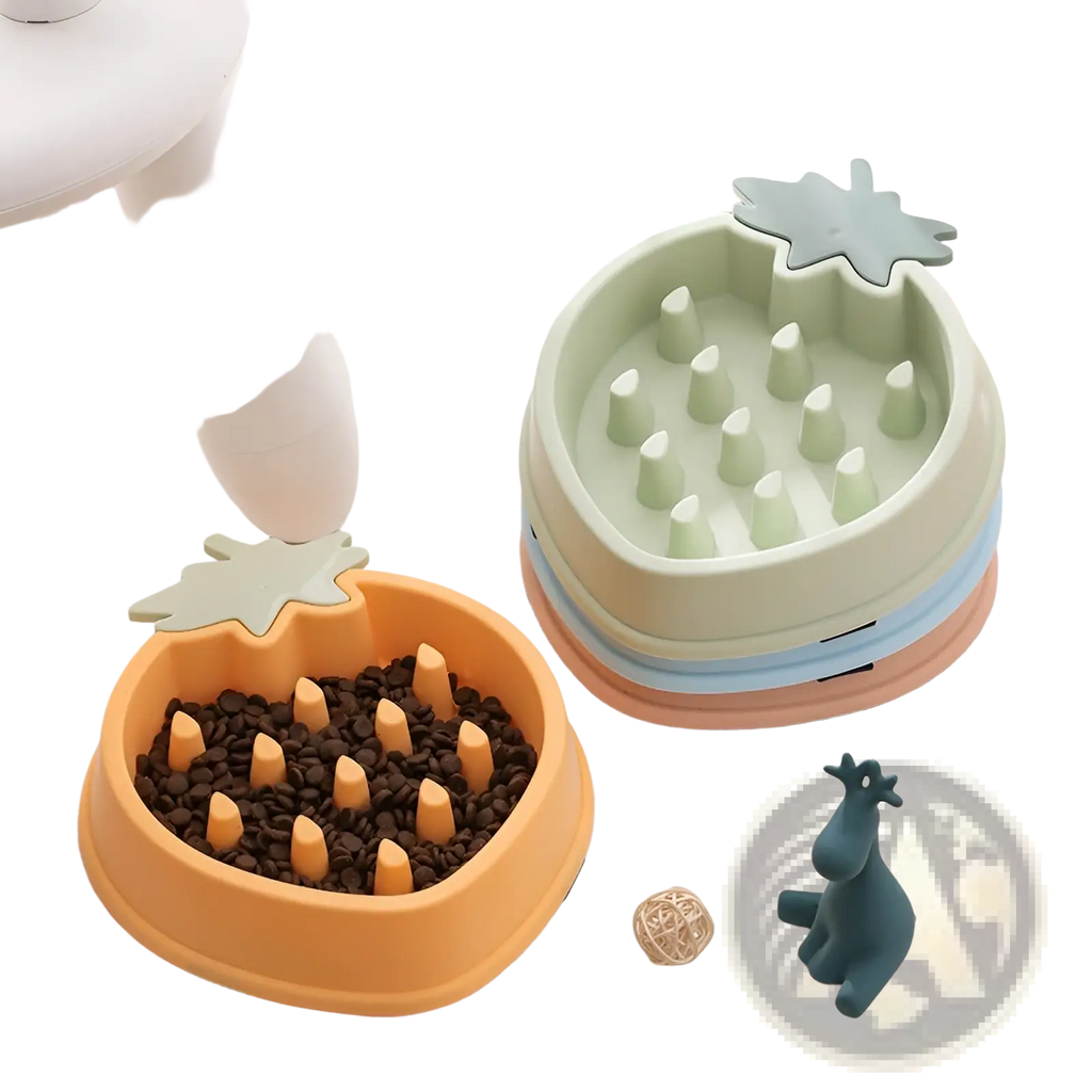 Orange pineapple-shaped slow feeder dog bowl made of plastic filled with kibble for pet feeding