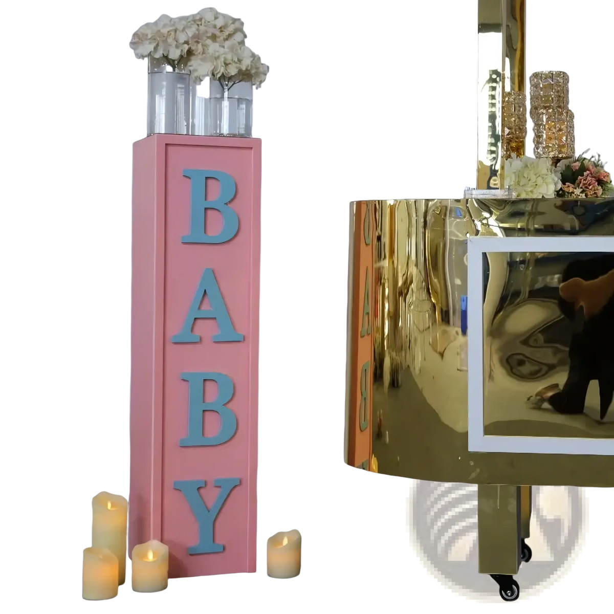 Pink baby shower balloon box decoration featuring a pink rectangular pillar with light blue 3d baby letters and white flowers