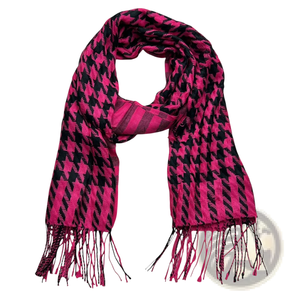 A vibrant pink and black houndstooth jacquard winter scarf with fringed ends for cold weather use
