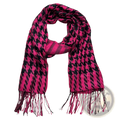 A vibrant pink and black houndstooth jacquard winter scarf with fringed ends for cold weather use