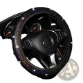 Black steering wheel cover adorned with sparkling rainbow glitter from the pink bling steering wheel cover set