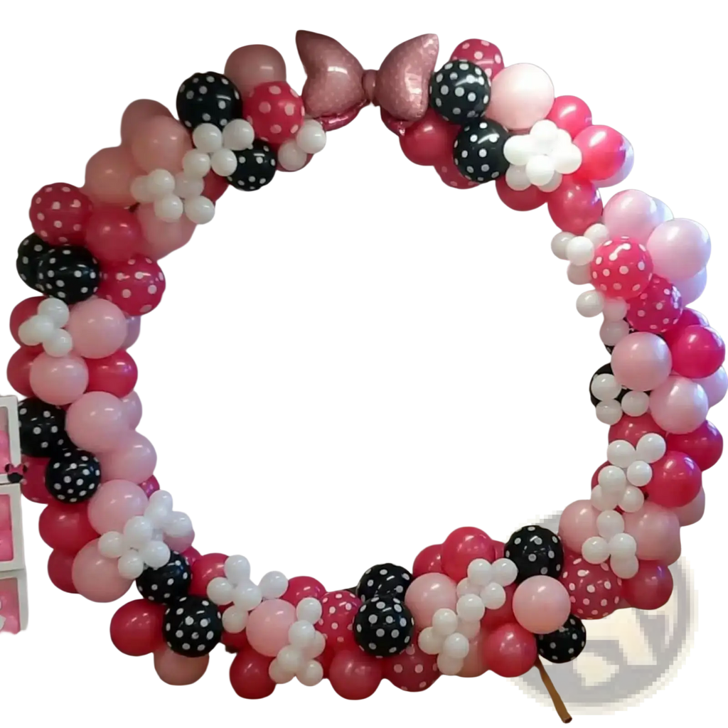 Pink bow balloon arch kit featuring festive pink black and white polka dot balloons for party decoration