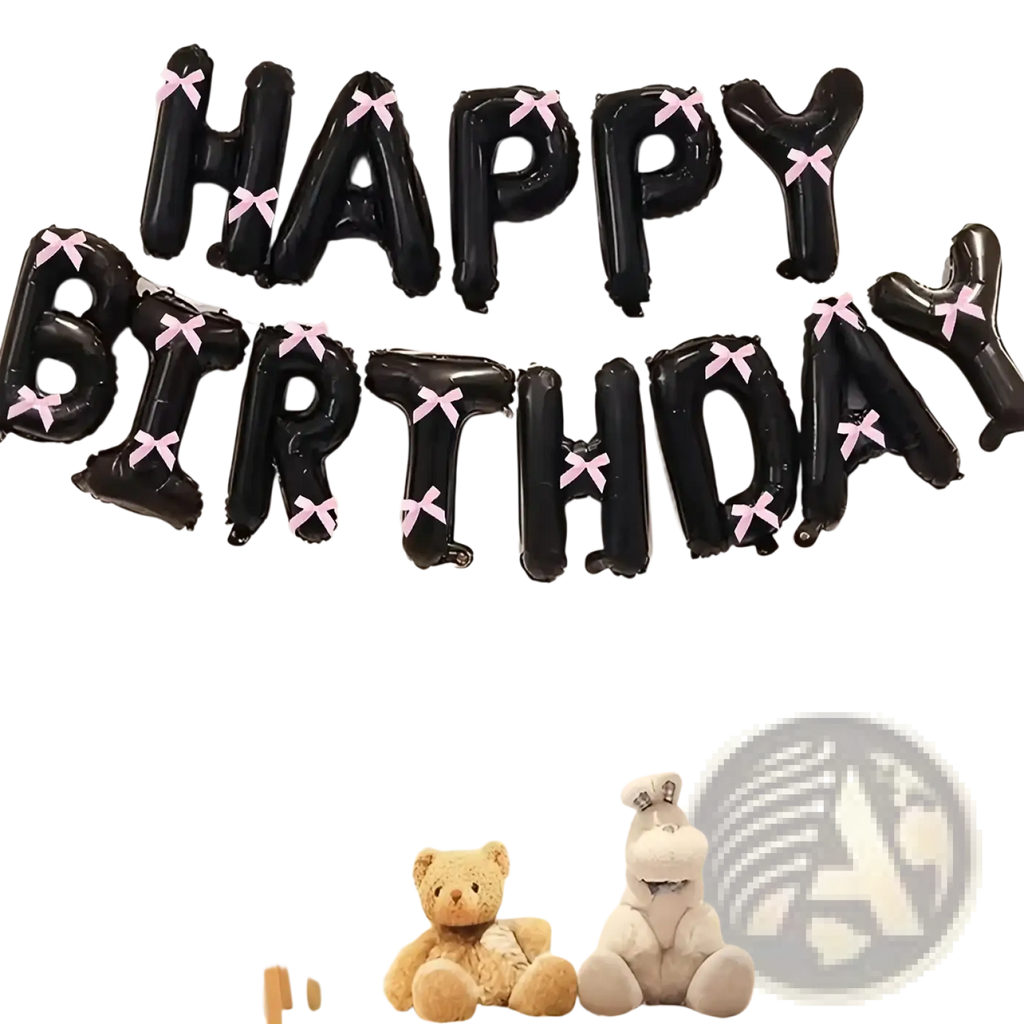 Black foil balloon letters spelling happy birthday with small pink bows for party decoration set