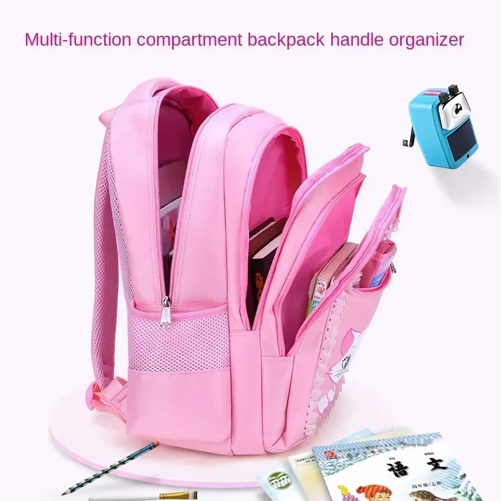 Pink cat school backpack set for girls featuring a multi-compartment design with mesh side pockets and cat face detail