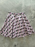 Pink cats and hearts checkered skater skirt featuring a pink pleated design with black cats and floral patterns on light fabric