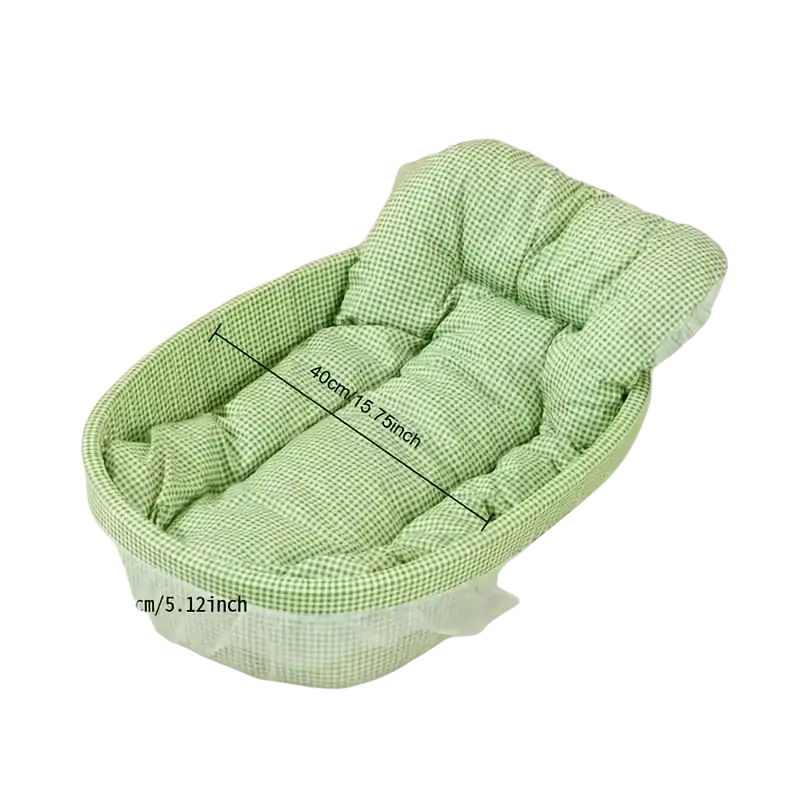 Green checkered fabric baby bath seat with padded cushioning and sheer white mesh skirt for infant comfort
