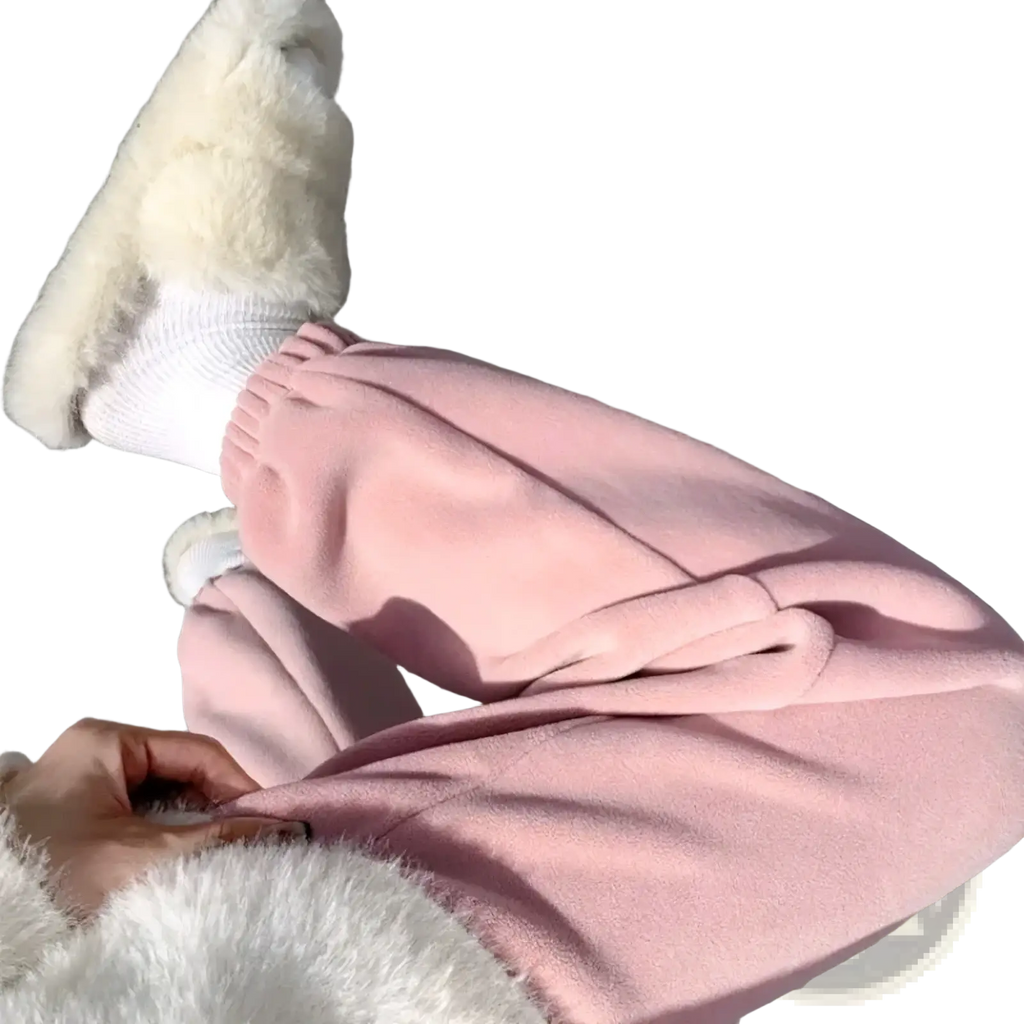 Soft pink fleece women sports pants with thick warm material, elastic cuffs, and a cozy relaxed fit