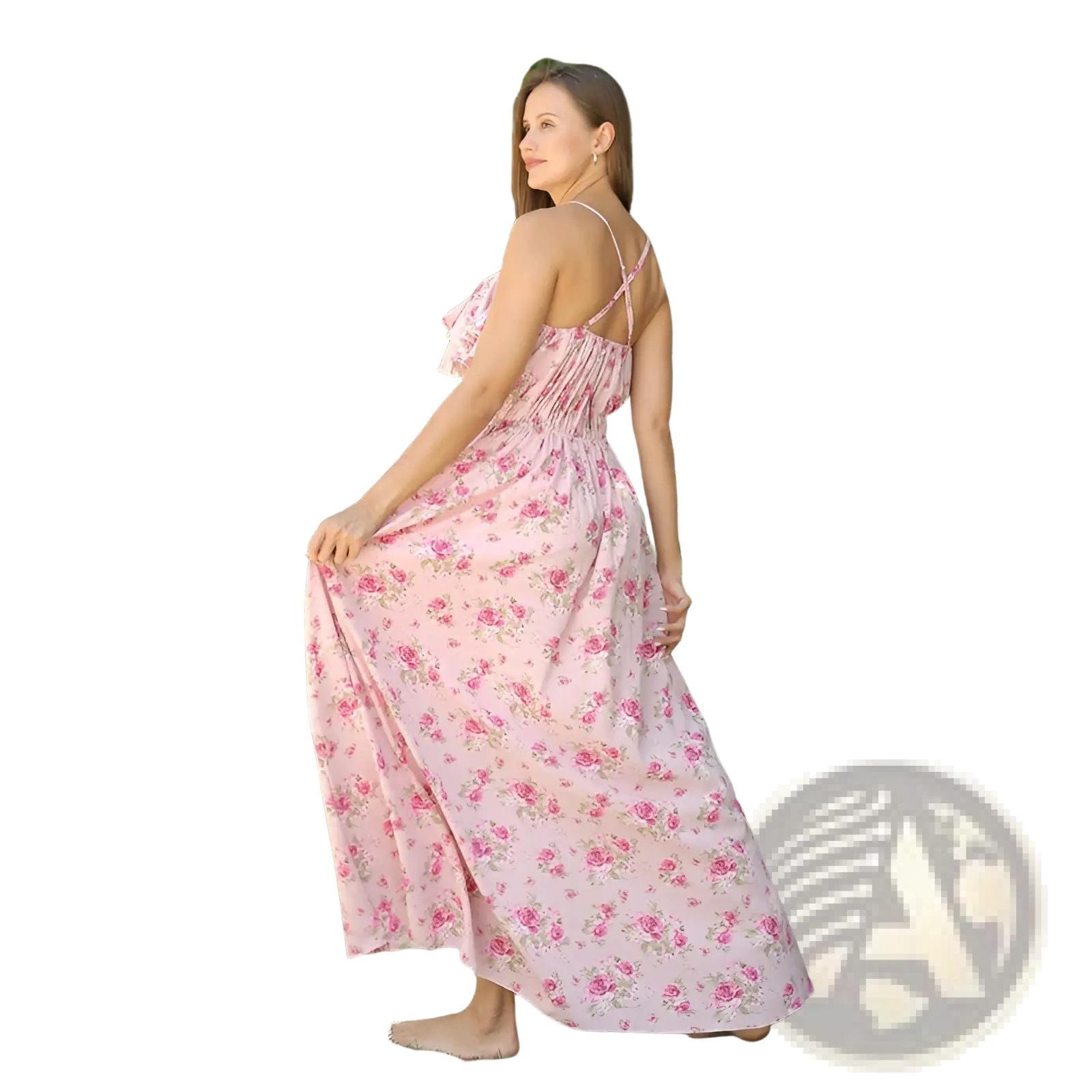 A woman wearing a pink floral maxi dress with delicate ruffled straps and a gathered bodice