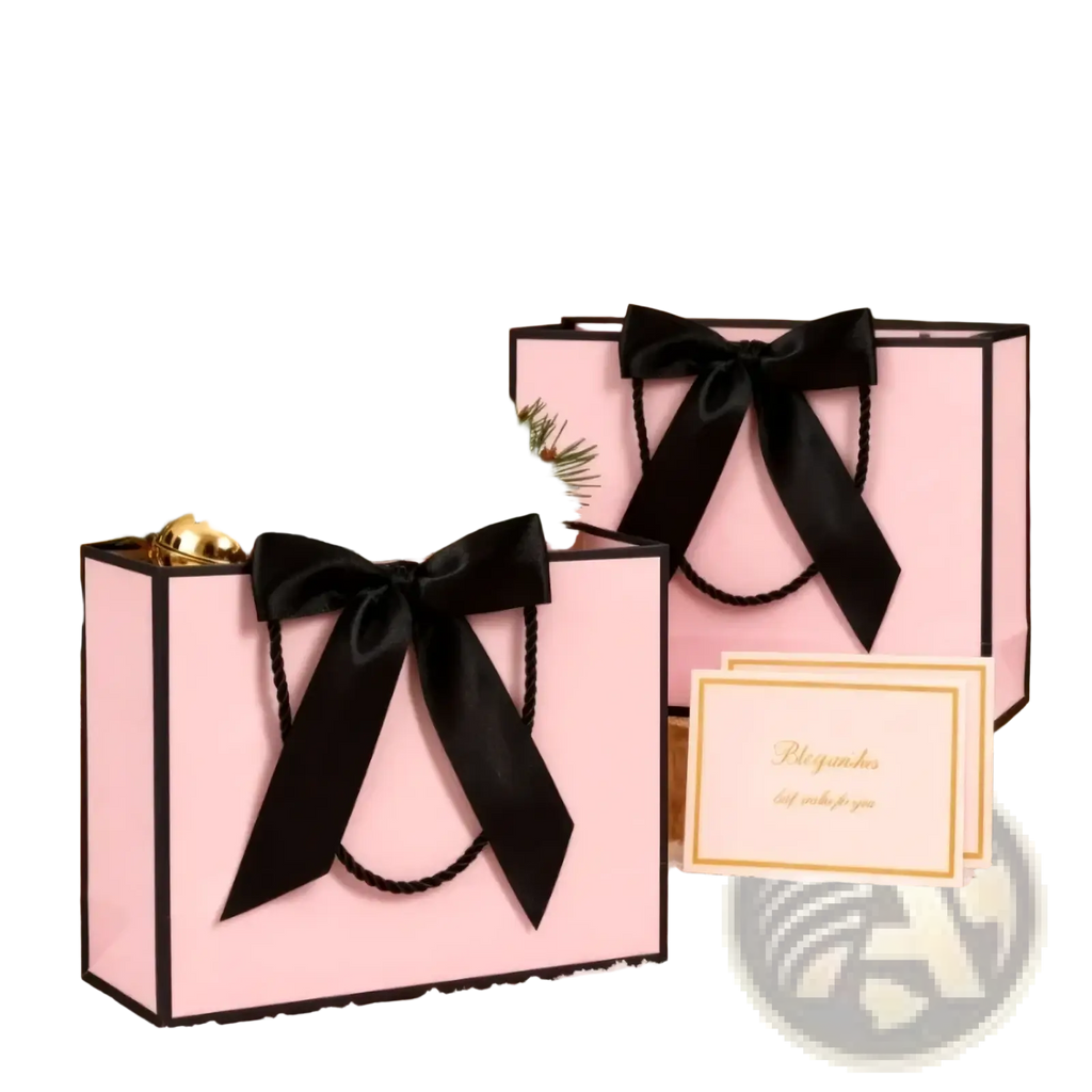 Pink gift bags with black satin bows gold bells and pine branches in a bows and cards set for festive packaging