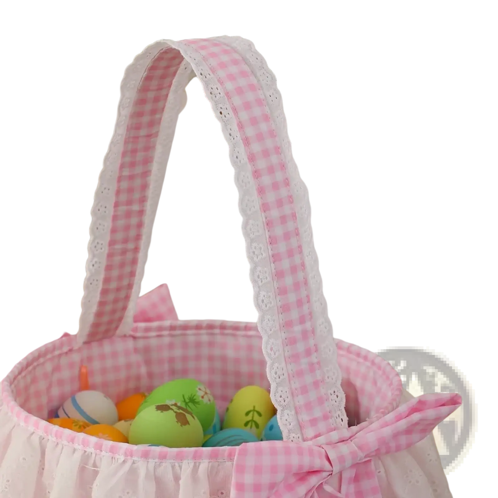 Pink gingham easter basket with white lace trim and matching bow made of fabric for easter celebrations
