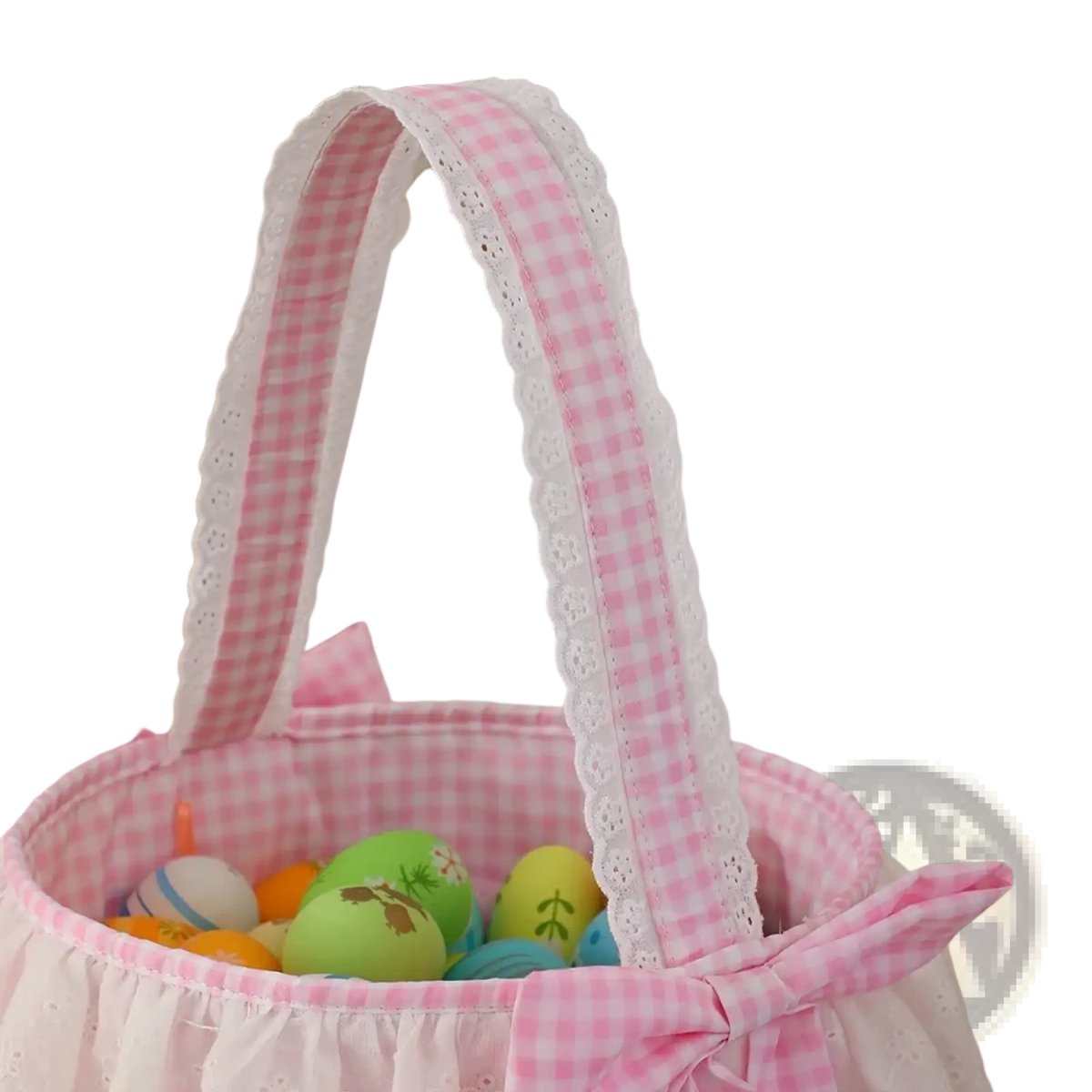 Pink gingham easter basket with white lace trim and matching bow made of fabric for easter celebrations