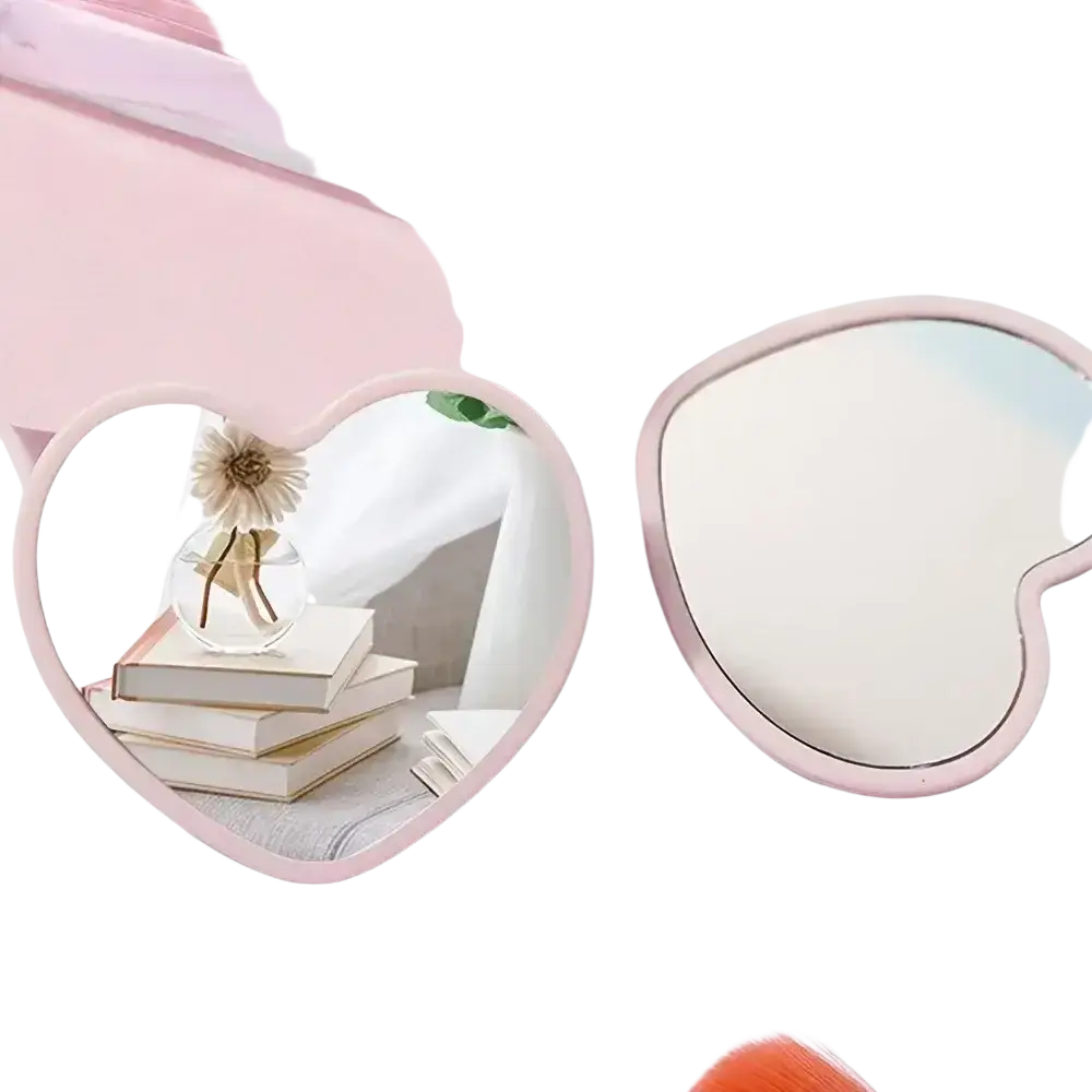 Pink heart-shaped compact mirror with a smooth glossy finish perfect for bridal shower favors and shower favors sets