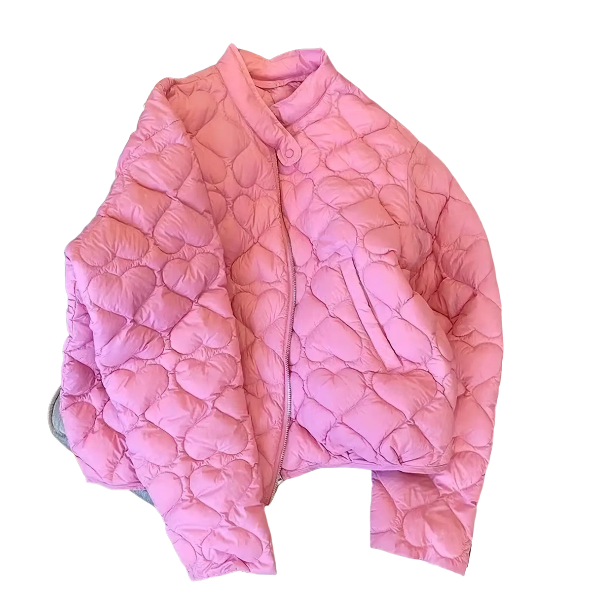 A soft pink quilted puffer jacket with heart-shaped stitching and a stand-up collar, ideal for cold weather
