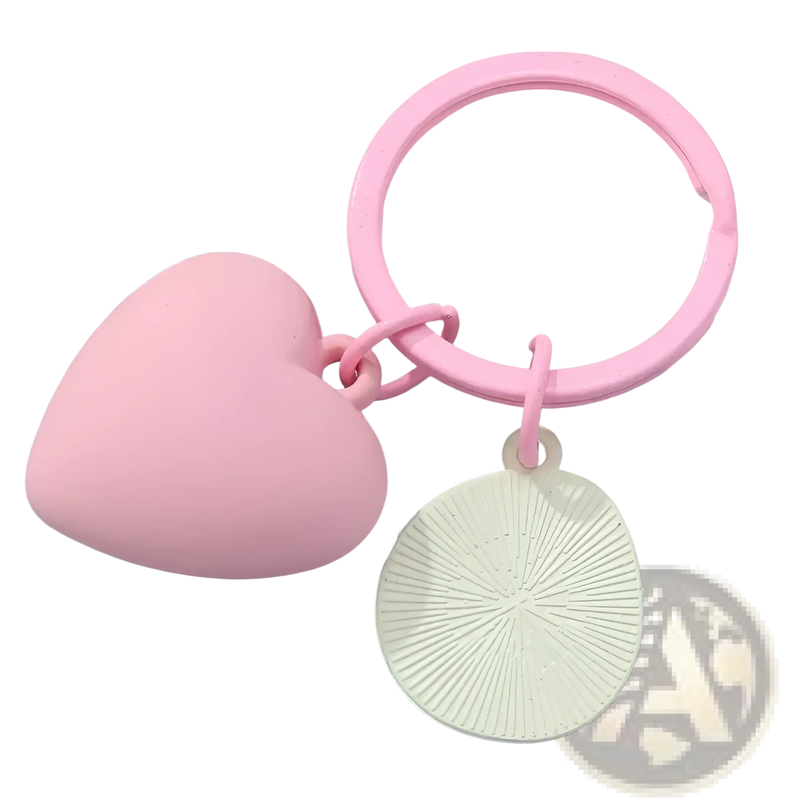 Pink heart smiley face keychain featuring a pink heart ring and an off-white circular charm with radial grooves