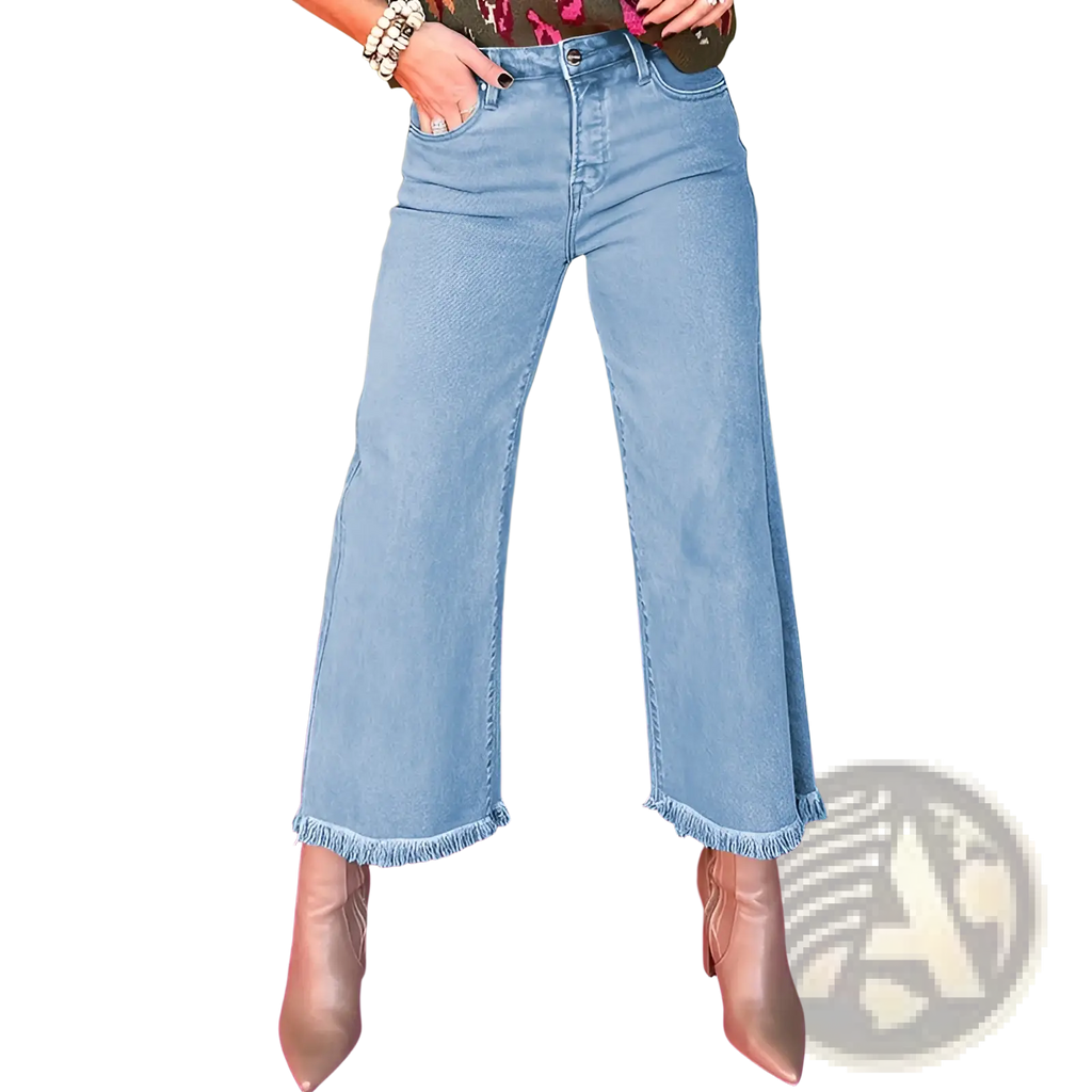 Pink high waist frayed denim wide leg jeans in light-wash denim with wide legs and frayed hems visible from the front