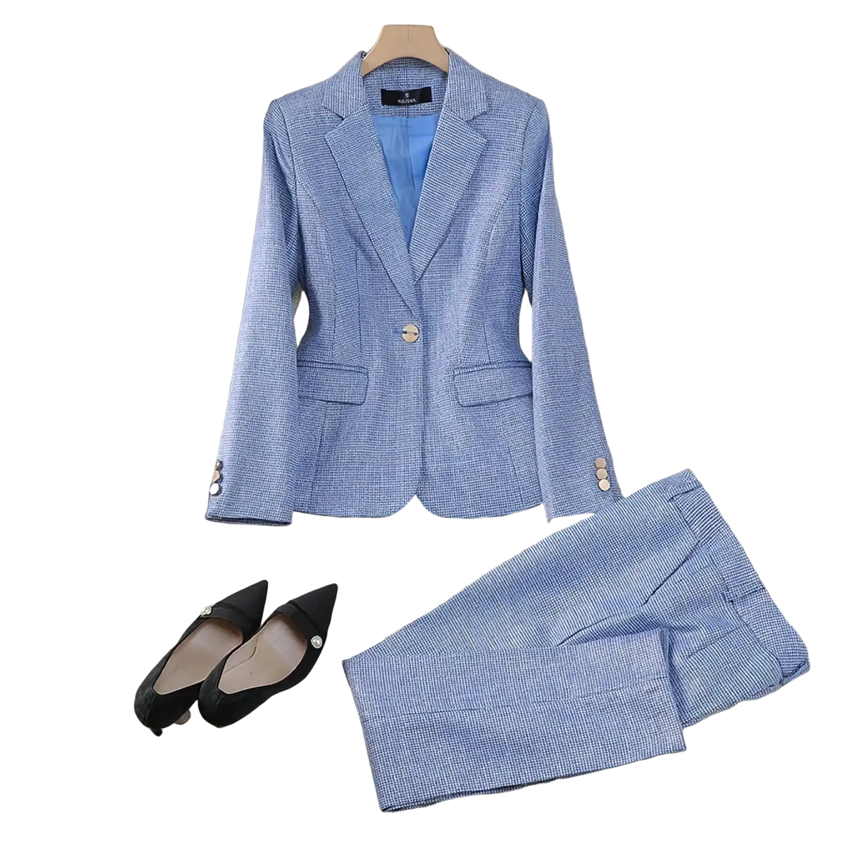 Light blue tailored blazer with subtle checkered pattern and gold-toned buttons for professional women’s pant suit