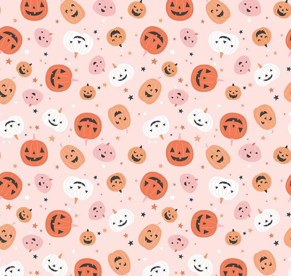 Pink jack-o-lantern vintage bow top featuring a cheerful pattern of orange and white cartoon pumpkins on soft pink background