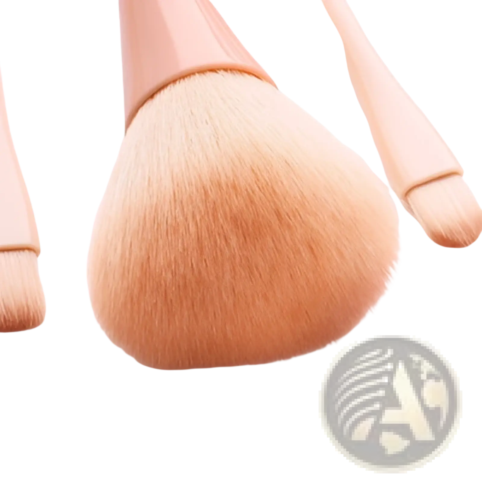 A soft peach-colored makeup brush with a rounded fluffy nylon head and rose gold handle from the pink makeup brush set 10pc