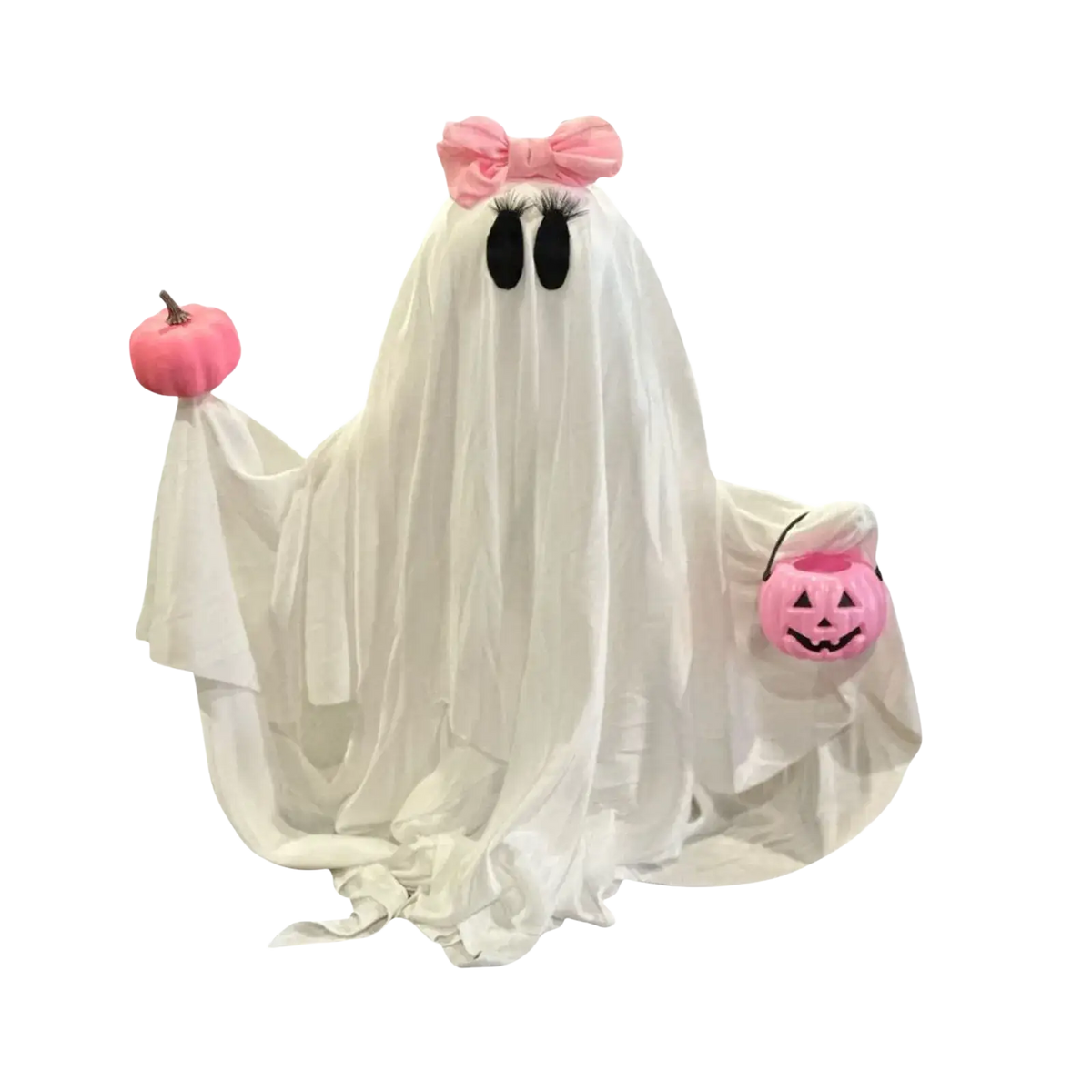 A plush white ghost tabletop decoration with a pink bow holding a pink pumpkin and jack-o-lantern basket