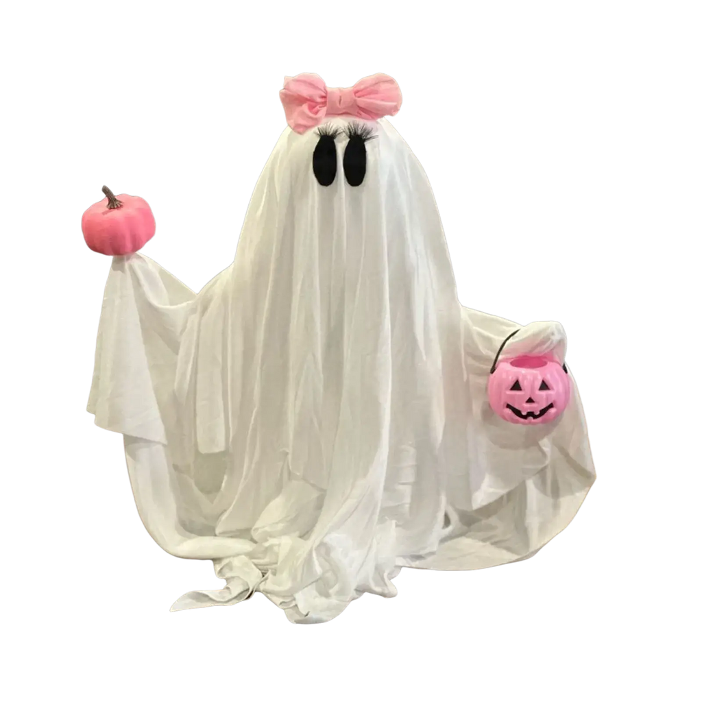 A white fabric pink pumpkin ghost halloween tabletop decoration with black eyes, a pink bow, and pink pumpkin accessories
