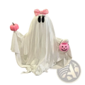 A white fabric pink pumpkin ghost halloween tabletop decoration with black eyes, a pink bow, and pink pumpkin accessories