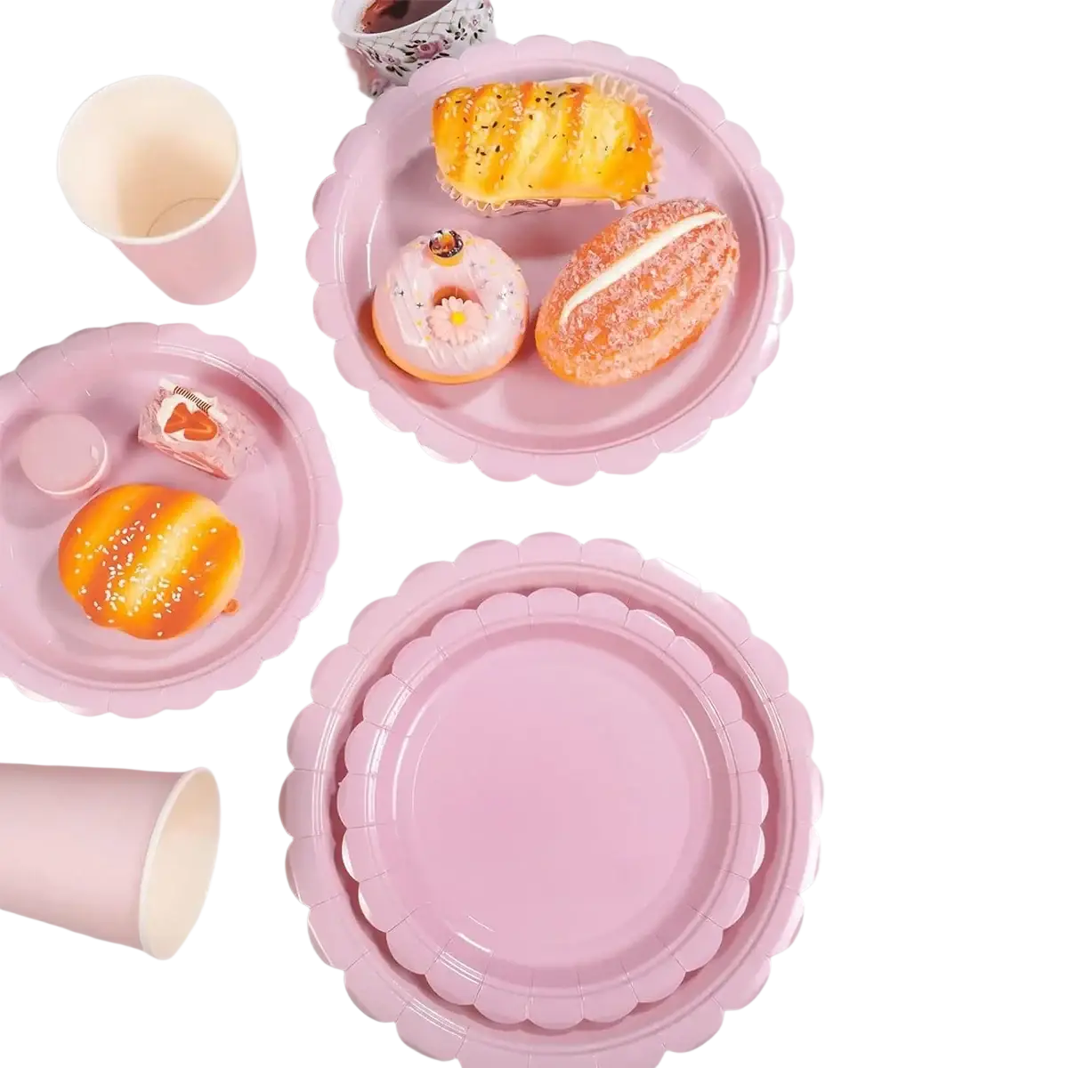 Pink scalloped disposable party paper plates with glossy finish perfect for festive tableware sets