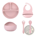 Pink silicone baby feeding set with suction base includes three-compartment plate bowl bib and utensils for mealtime