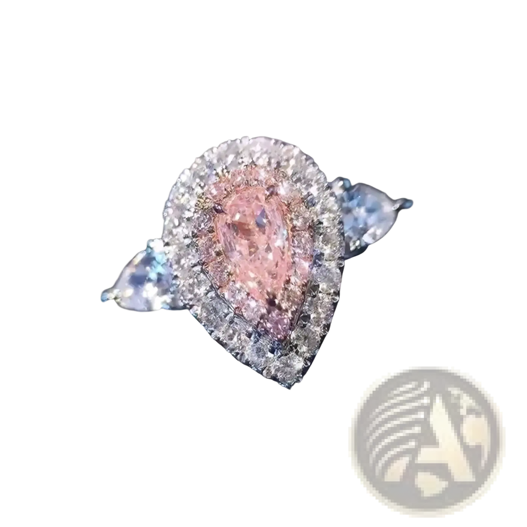 A pink teardrop zircon engagement ring with a pear-shaped pink diamond haloed by sparkling clear diamonds